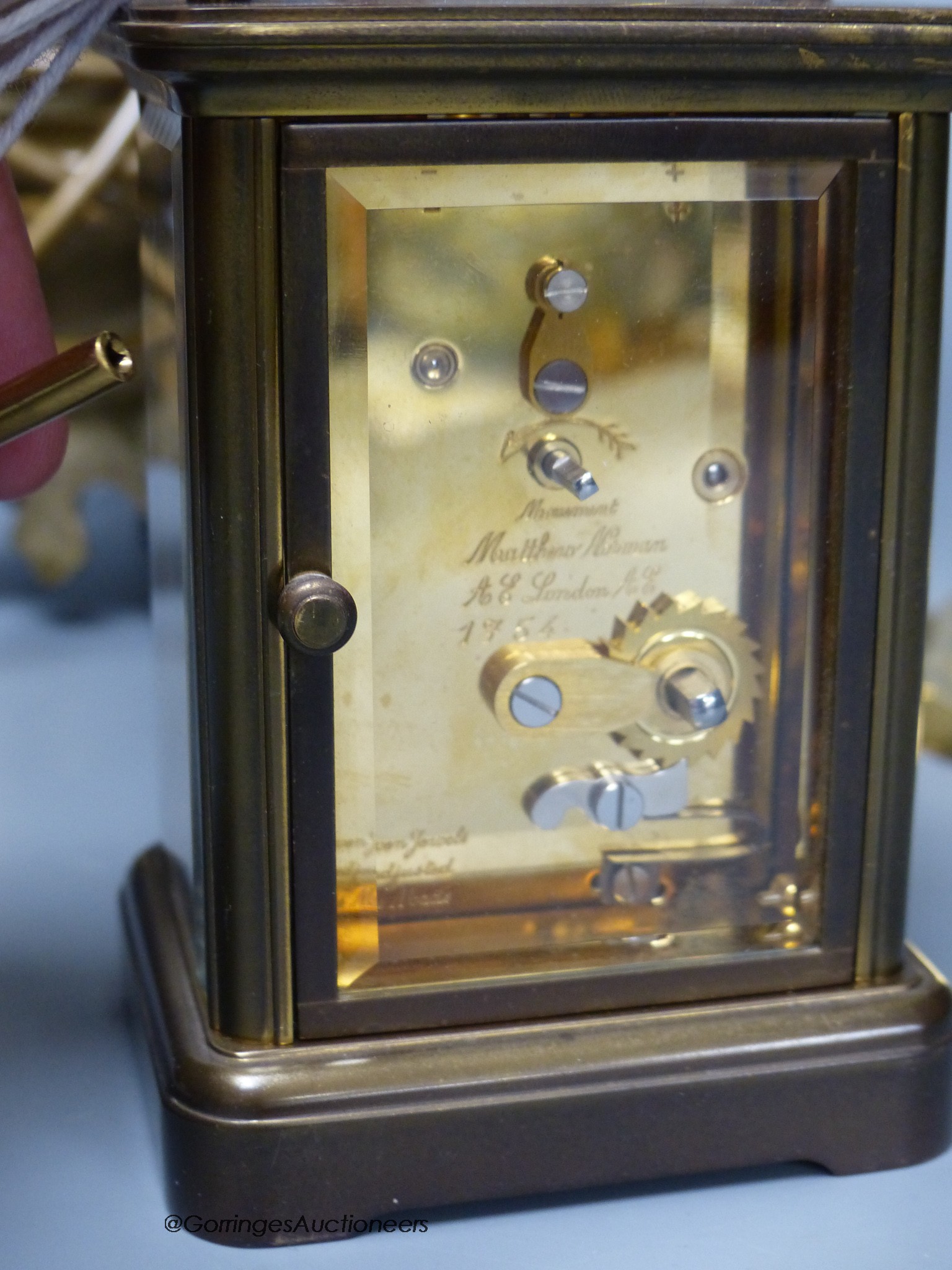 A Matthew Norman brass carriage clock, No.1754 together with a pair of brass candlesticks and a table lamp